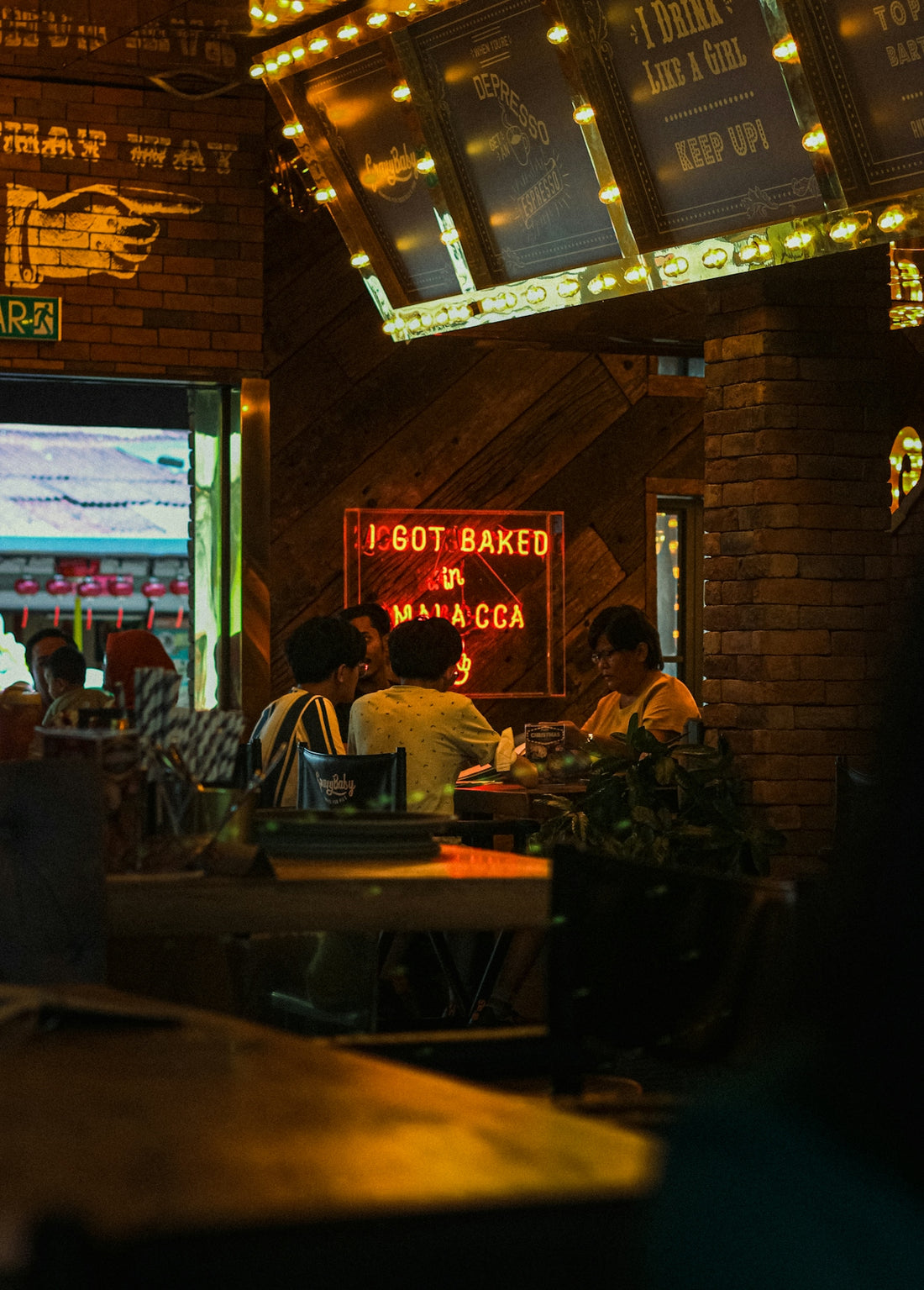 a group of people sitting at a table in a restaurant