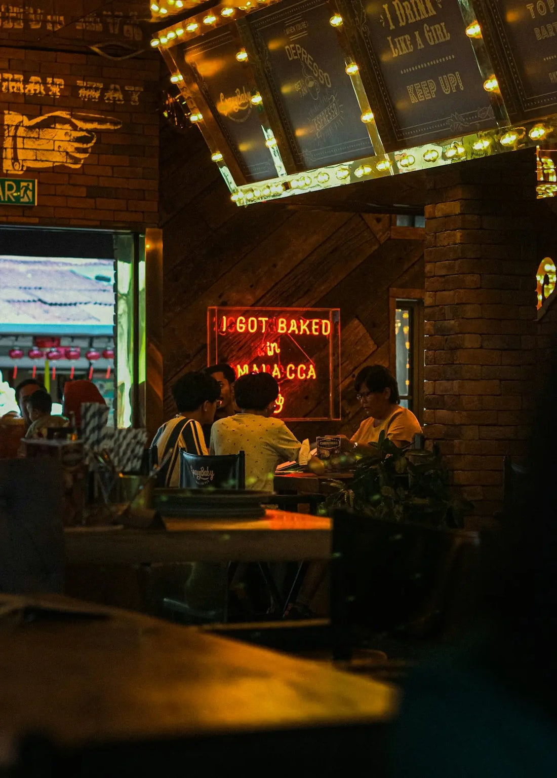 a group of people sitting at a table in a restaurant