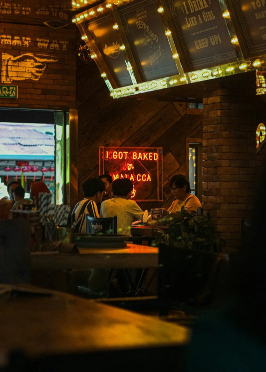 a group of people sitting at a table in a restaurant
